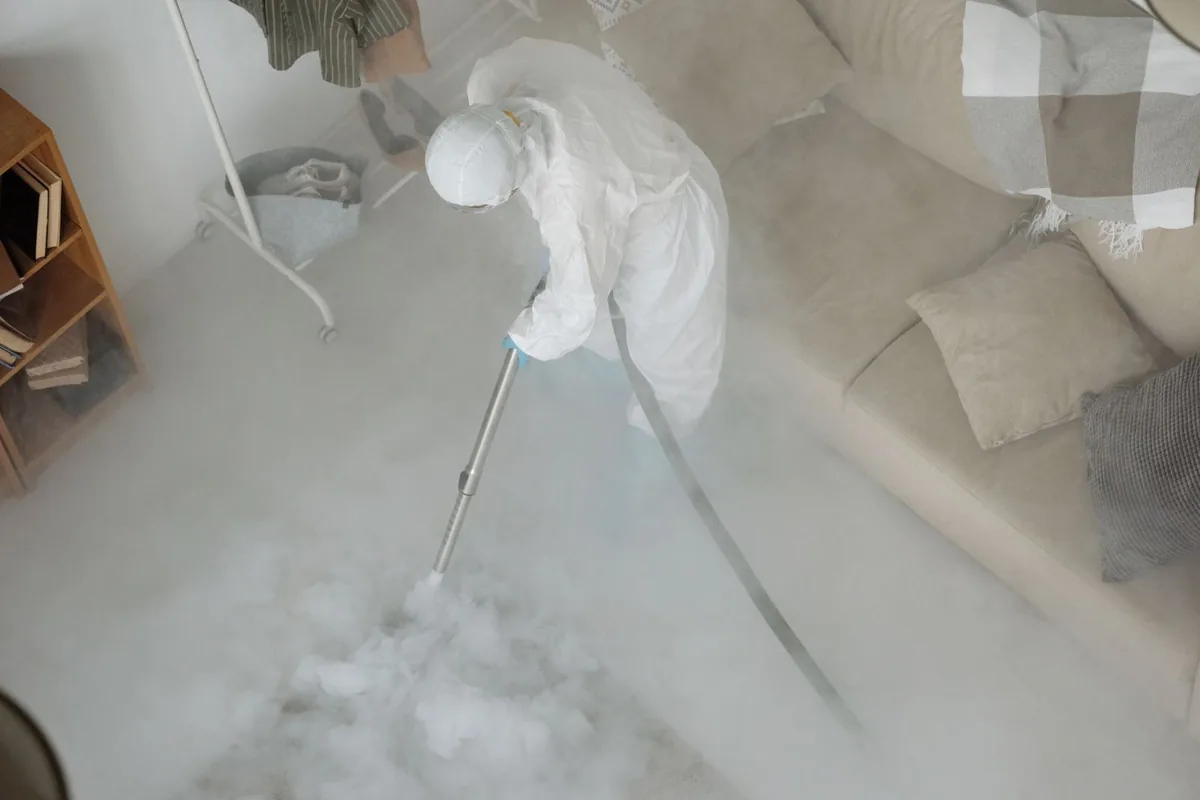 Biohazard cleanup technician in protective equipment, Mabton, WA